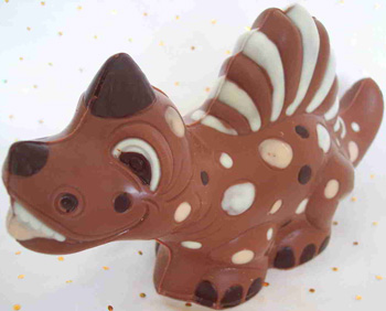 a picture of a milk chocolate dinosaur decorated with white and dark chocolate