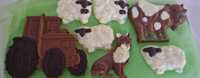 a picture of milk chocolate farm animals and tractor