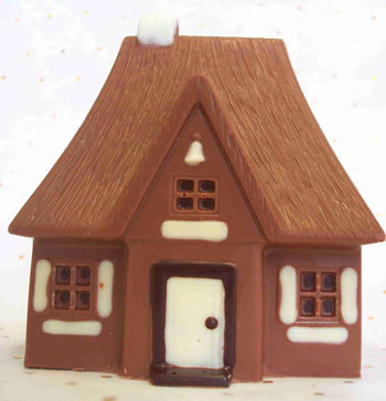 a picture of a milk chocolate house decorated with white and dark chocolate