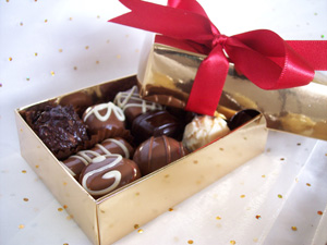a picture of mixed truffles in a gift wrapped box