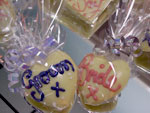 a picture of small chocolate love hearts, one with 'Groom' and one with 'Bride' written in coloured chocolate