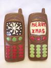 a picture of two milk chocolate Chrismas moblie phones